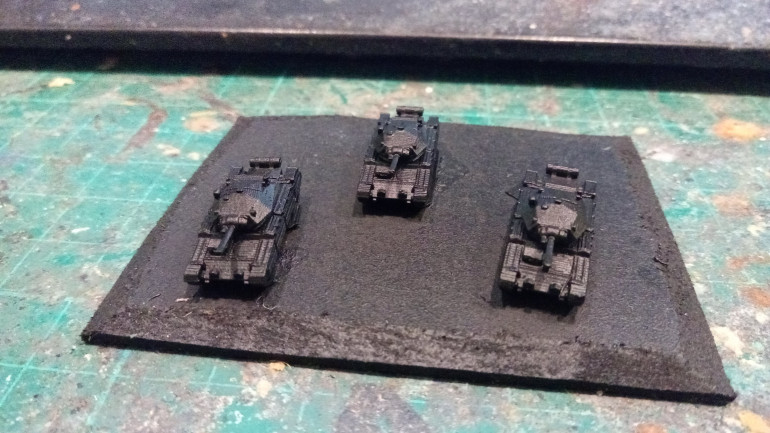 After gluing them on the bases I sprayed them with a Black undercoat