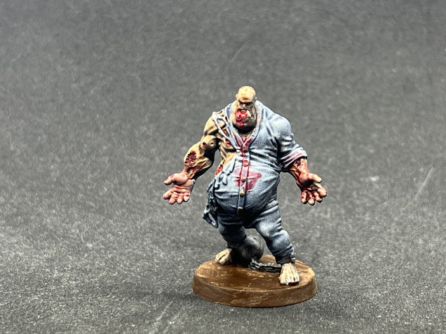 The other model is a bit more conventional while retaining visible mandibular deformity. They are also much easier to paint as they wear a convict 'onesie'.