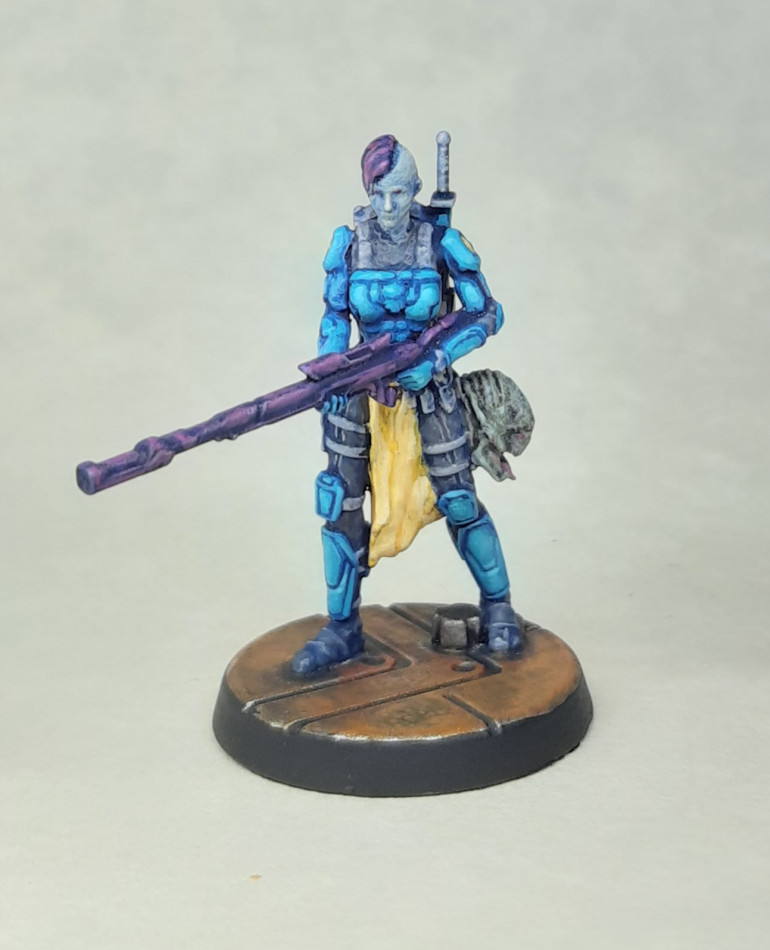 This is one of plastic Starfinder RPG figures produced by Archon Studios. Although 28mm, the proportions are quite slender, and details a little shallow, so I been putting off painting it. Motivation and inspiration came in the form of the solo-RPG Notorious arriving in the post. This rpg is essentially about playing one of the bounty hunters from Star Wars as they track down a contracted target. Reading the rules got me keen to paint an appropriate model, plus the cover of the book gave a nice colour scheme to use.