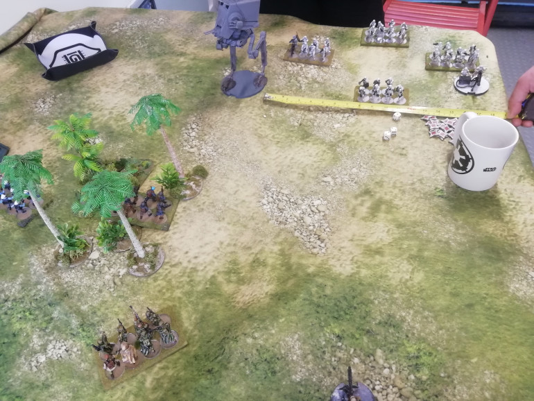 Only infantry can stay in cover and receive half damage. Using the jungle in the table center the Rebels pepper the empire with damage as they try and take the hill. The rebel vehicle on the hill also takes less damage being hull down. 