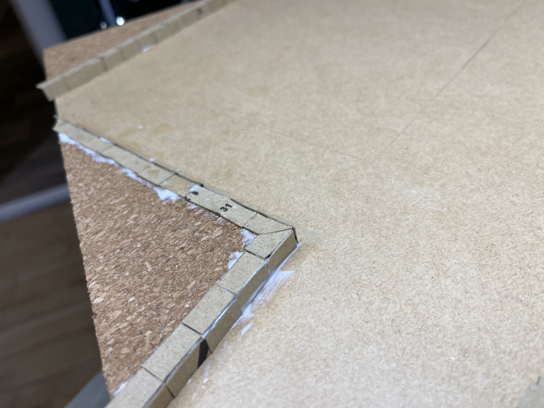 cardboard cut to 8mm x 15mm as curb stones