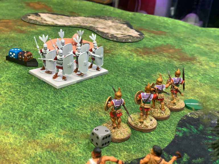 The Romans have been content to have their cavalry hurl javelins at the slingers and then retreat but they finally unleash their heavy infantry. Hoping to disrupt their formation, the Pezhetairoi move out and hurl javelins of their own to little effect. 