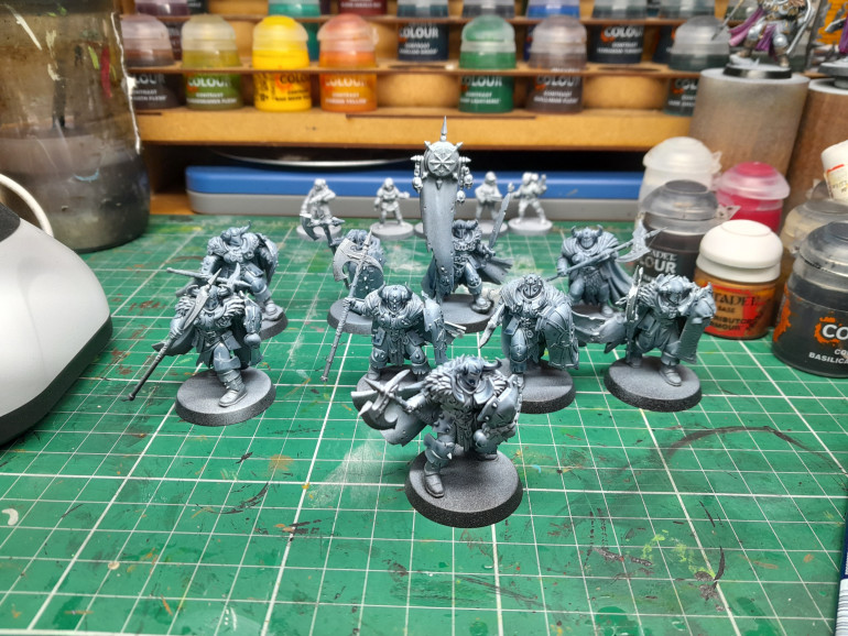 Zenith with dead white followed by wolf grey on armour. Then space wolf grey sprayed on.