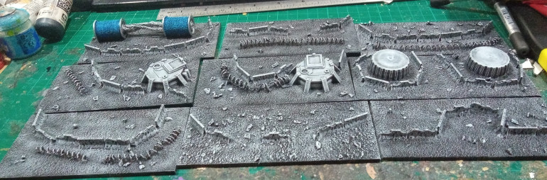 The original pieces, some 3D Printed Dawn of War Style bunkers, the bottle caps will have some AA Guns put on them once I get some more resin.