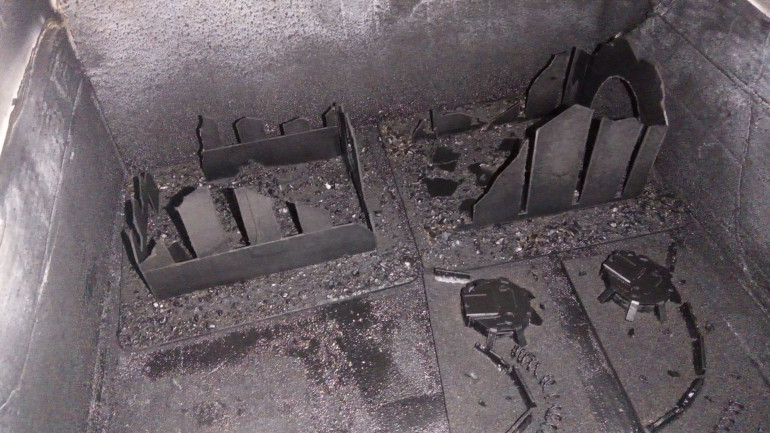 Sprayed with Chaos Black to not only give a base layer but seal the basing mix