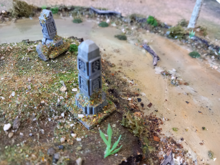 One scenario involves a hill surrounded by a 6 inch moat. I made the whole thing out of foam board withe some water effects