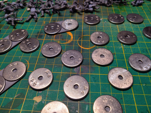 I always stick a washer on my Bolt Action miniatures with a magnet in the hole, it's a pain ,but gives them a satisfying weight.