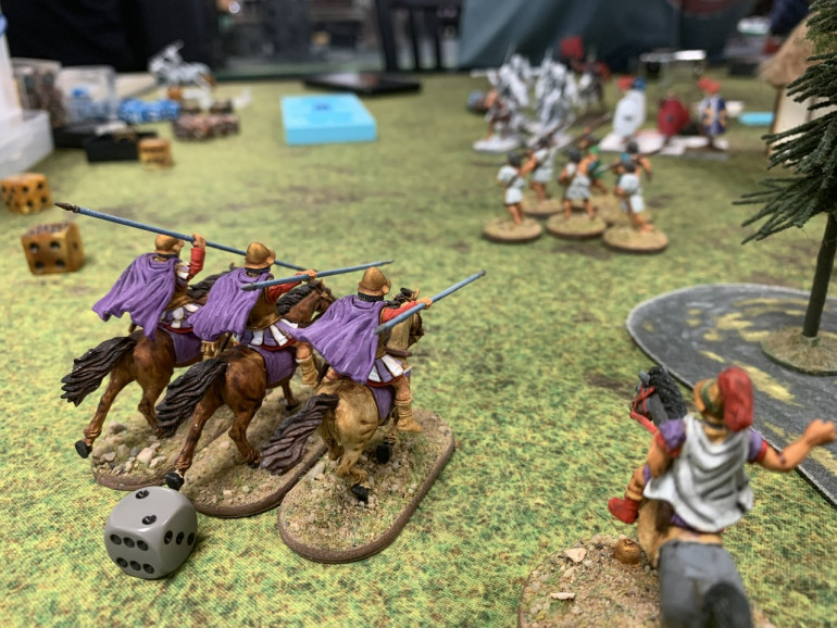 Instead he rushed forward and instead of lobbing javelins at my cavalry, charged them, killing half the unit, then falling back. Their morale held but they still accumulated fatigue. 