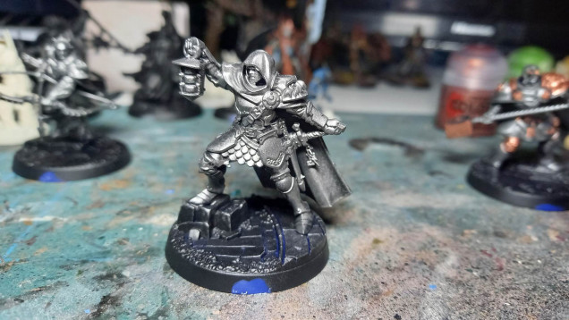 Drybrush with a suitable metal paint (in this case, it was Leadbelcher)