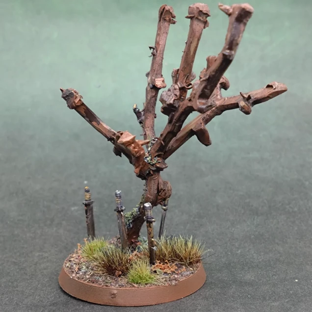 I made a sword tree. Inspired from a sketch by Ben an age ago. Made from GW sprues and Mantic Games skeleton swords.