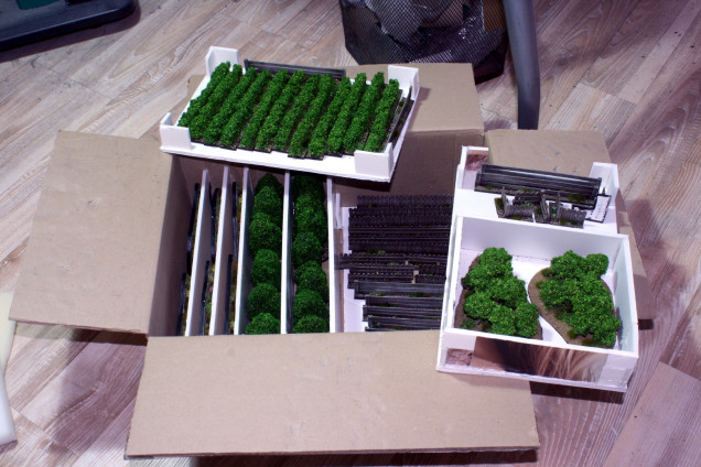 A multilayer storage made from a cardboard box and foam board off-cuts.