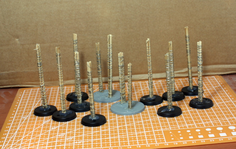 Kebab skewers tied together and glued to the bases.