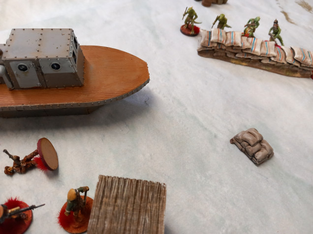 The female members of the crew rush forward using the icy conditions to slide closer to their objective but are in the open and take fire