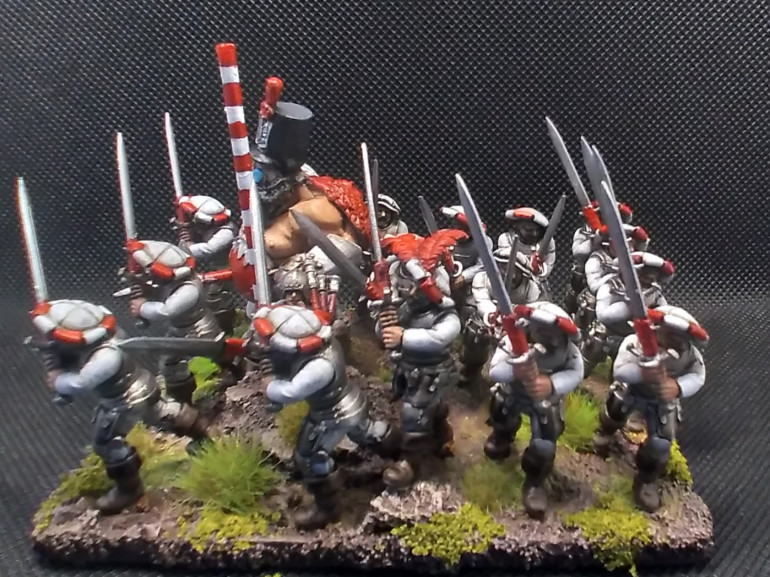 This is my first complete unit (just needs a banner on the pole so people don't think that they are barbers) went with a white and red uniform as a nod to an old talabheim empire army I used to have