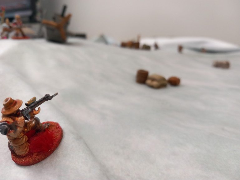 Perry snipes at the enemy as they appear above the snow drifts forcing them to take cover