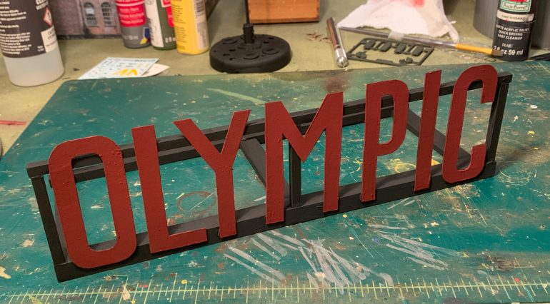 Mount the letters on the framing.  It ain't Hollywood, baby!