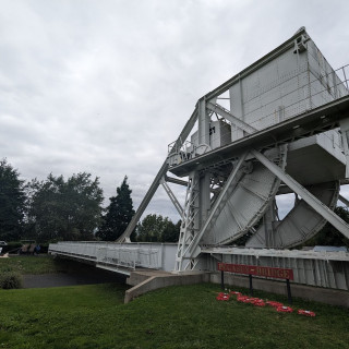 Pegasus Bridge, with the first house liberated in France and a replica of gilder featuring real tyres the museum had to buy off a French farmer who was using them on a cart.