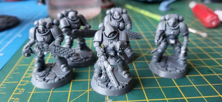 I've also gathered up a colleciton of Infernus Marines, via the miniature of the month and visiting several warhammer stores with my boys.  I have converted three of them to get some variety in the squad.