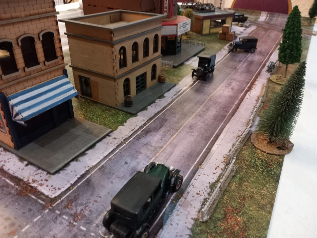 This month's game night at work is Chicago way ny great escape games. I acted as rules master for two groups of my work mates. The scenario was gauntlet. The gangsters had to get at least two models down the road and over the Canadian border. I supplied all the minusxand scenery but only one player is used to these sorts of games.