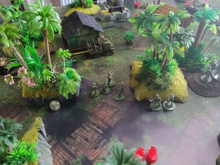 The remnants of an Australian infantry unit push towards the outpost in the middle of the map