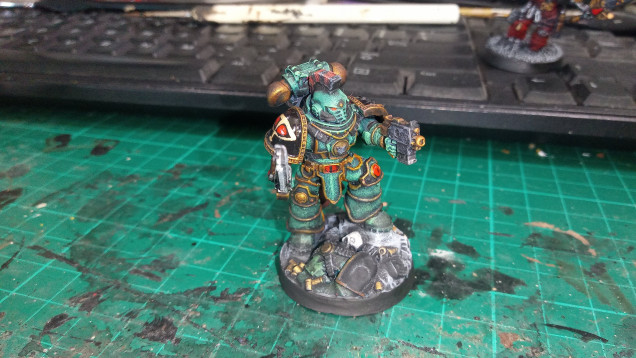 I basecoated the mini with a 75/25 mix of Caledor Sky and Warboss Green. Then I washed it with Vallejo Black Wash. Finished it off with a drybrush of 75/25 Moot Green and Lothern Blue or near enough.