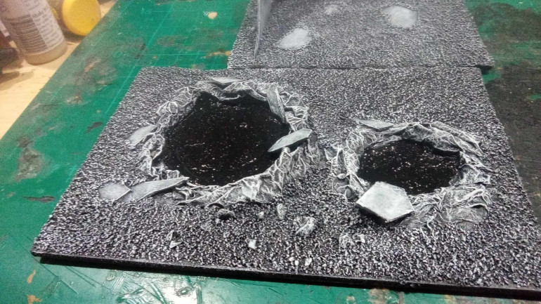 The craters turned out well, they were a bit of an experiment but at this scale and considering they used about four squares of toilet paper I think they turned out well. The Black paint is still wet but I plan to give them a glossy varnish to make it look like a big pool of stagnant water. Game wise these are also a great way to block movement but not shooting. 