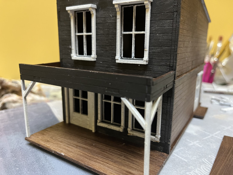 Window and door details done. Next up, some touchups to the paint and signs.