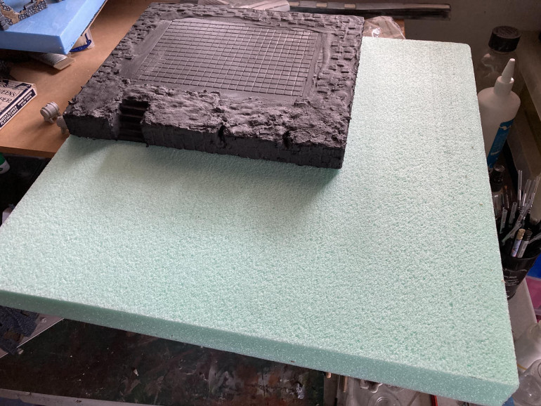 put some tiles on the top piece and plastered over it to get a rough effect.