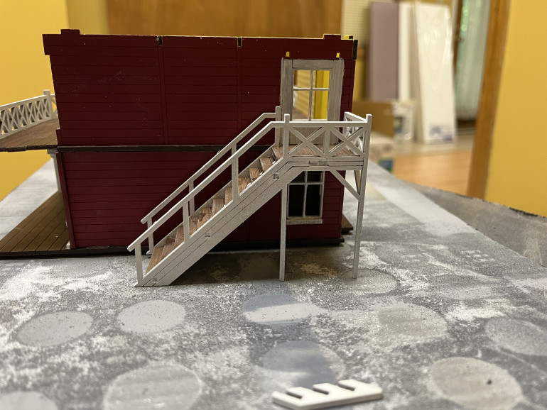 A different view of the stairs. As designed, the only contact point for the stairs will be to the floor of the second story. If glued into place the stairs would come off when you remove the second story. That’s not tenable so the stairs will have to be a separate assembly.