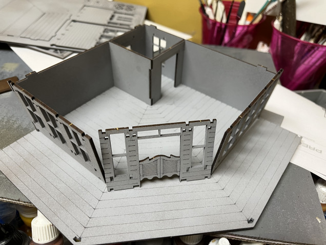 A significantly more complicated watering hole. This is a two story saloon with an exterior staircase, and both a sidewalk and second story wraparound balcony with a significant number of windows. I’m going to have to make a lot more sub assemblies. And I’ll probably wind up painting everything first before assembling them. 