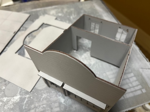 This time when I assembled everything I glued the walls together and put them on the base but didn’t glue them to the base. I then let the glue dry and removed the walls as seen here. Should make painting the interior easier. 