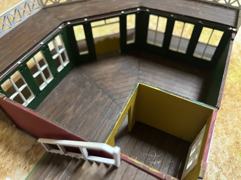 Second floor removed, with stairs left in place, showing the interior of the first floor.