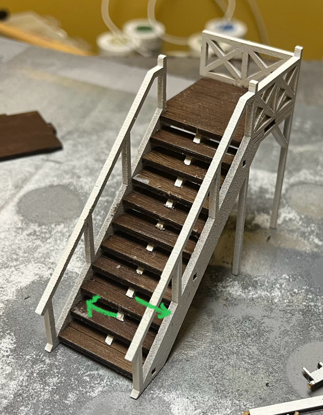 See that white thing that’s mostly running up the middle of the steps?  I think it would’ve been better to glue those up against the opposite sides as indicated by the green arrows. Unfortunately I broke one so this’ll have to do. 