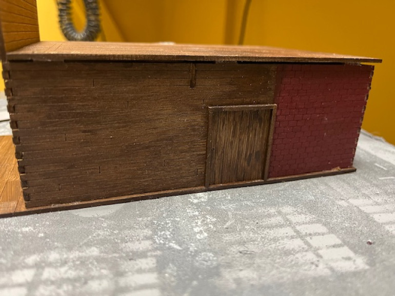 Side door with door frame attached. There’s an exterior door frame but no interior. 