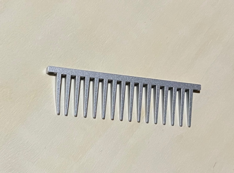 The comb attachment from a blowdryer