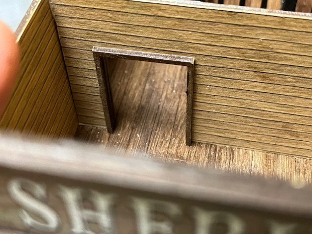 Detail of interior door heading into the cell area. The supplied doorframe neatly hides any rough edges around the door. 