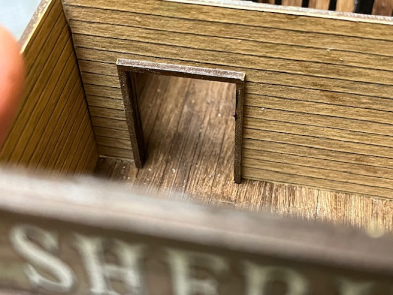 Detail of interior door heading into the cell area. The supplied doorframe neatly hides any rough edges around the door. 