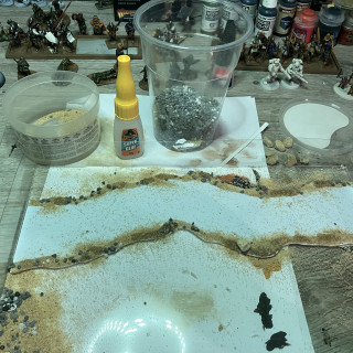 Step 3: Glue on sand/rocks