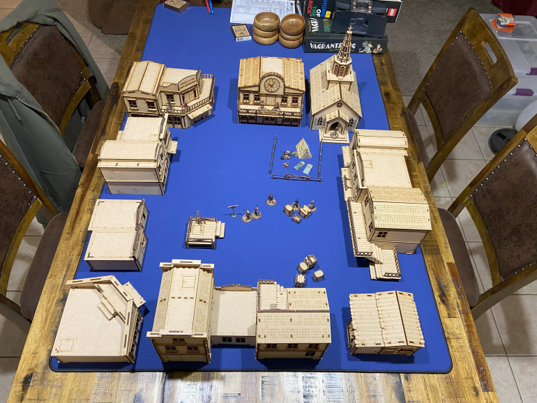 OK, so I didn't buy it all but I did buy too much for what I need.  But anyway, after a week of building, roughly 400 X-Acto blades, and destroying all the nerves endings in my fingertips, I have built the town.  Next up, base coating.