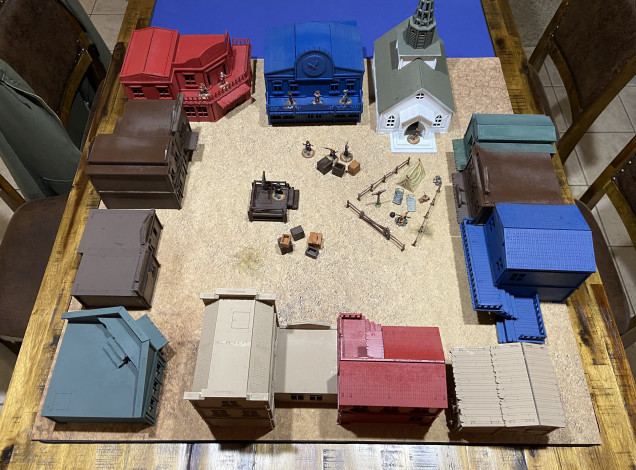 Each of the buildings is now base coated with rattle cans. Next I plan to weather then use paint pens to finish the store signs and add some accent colours. 