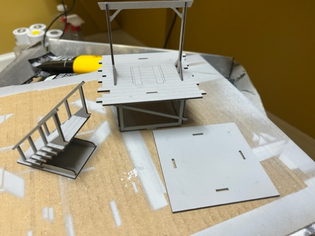 I made the stairs and stage separate assemblies to make them easier to paint. I used the gallows base as a jig to get the stage built but didn’t glue it to the base. Once the stage assembly dried I removed it from the base for the next step. 