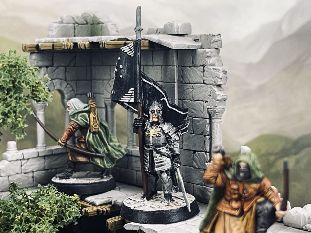 Now ready to spring their surprise attack to retake the first district of the ruined city. With the Rangers providing overwatch the junior Ensign climbs to the upper levels ready to raise the standard of Gondor once more to signify victory and liberation of their ancestral capital