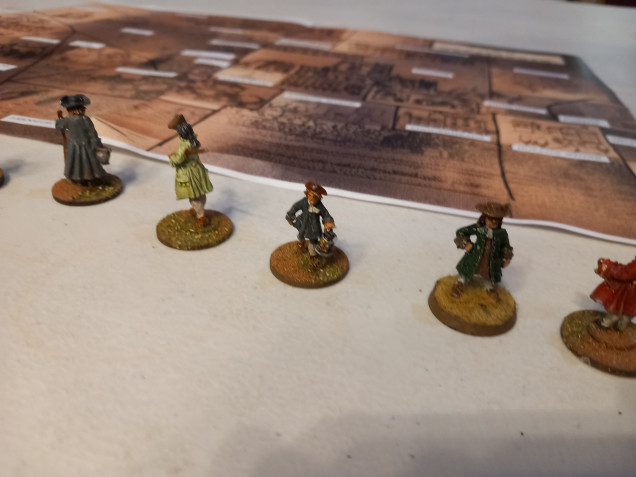 I found some suitable georgian minis for constables. I also used a plague doctor mini for the plague card to quarantine a location and a bull mini which escapes from the market.