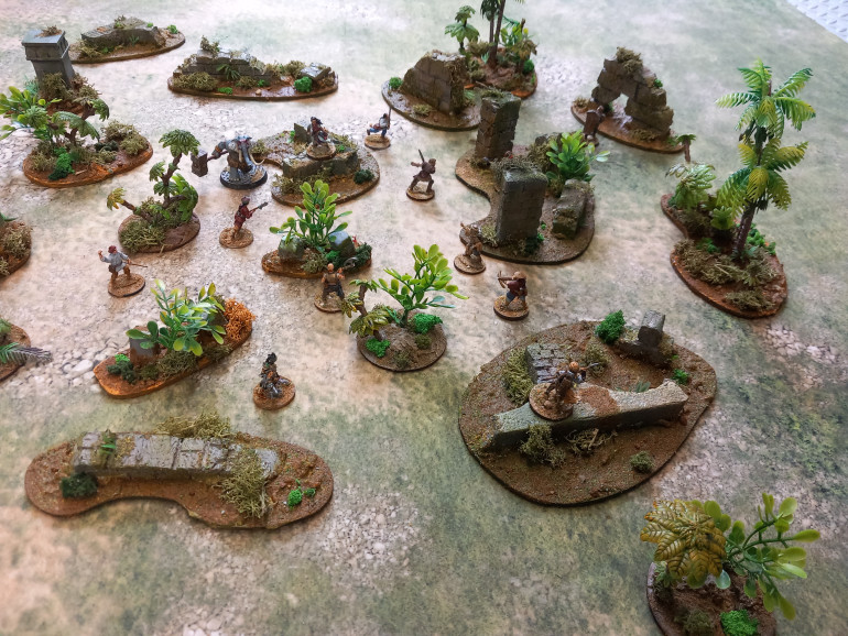 My scatter terrain was looking a bit tired so needed a bit of tlc. Some had square bases that I felt clashed with the organic nature of a jungle so I've rebased and used some failed 3d prints as standing stones. They were fallout lockers