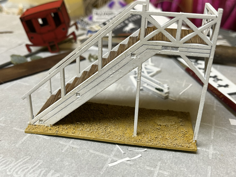 After painting the sand Desert Yellow, I dry brushed it with Skeleton Bone. The stairs are now done which finished off the Dentist’s Office