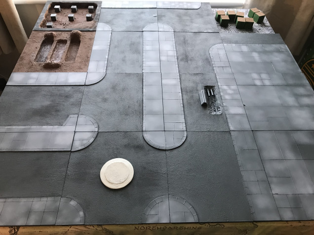 Using an airbrush, I highlighted the carved out grey pavement slabs. All slabs were hand carved with a Stanley knife straight into sheets of 3m MDF glued and pressed onto the TT combat tiles.