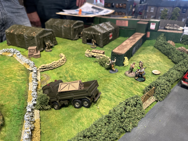 With two travel events triggered, the players spotted a crashed military truck and a point of interest spawned in an area near to the home base. It would require a scouting check to reveal it. Players continued to search cars and move toward the military truck. One of the players Candyman was having a terrible time searching. Not obtaining a single success, we joked that he was just checking the tyre treads. This evolved into Candmans role to only being someone who does POWDER checks on cars. The group eventually moved in on the military truck and fought with walker in the area. The players then discovered a military camp near the truck (convenient for a random event). It was a difficulty two scout role, so I’m impressed they got it this early on. Team 1 moved in the on the Camp. Team two headed to a nearby field with Candyman performing more POWDER checks on the way. 