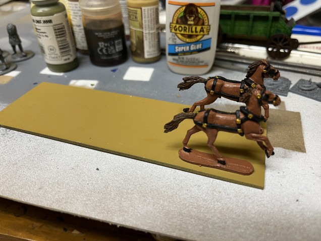 Here I just repeated the first step with the second horse. Once I glued the second horse in place, I removed the wagon again. 