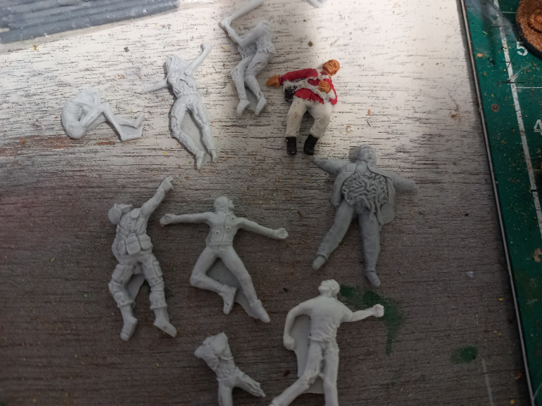 I have a selection of dead bodies some from tt combat and a perry miniatures zulu war brit who can be disguised as colonists cocooned on the wall