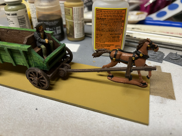 I positioned the horses and wagon to work out where everything should go. Once satisfied I glued one horse into place and let the superglue dry before going on to the next step. 